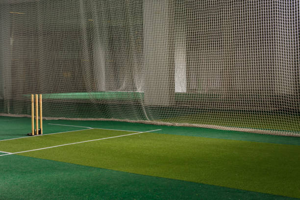 Indoor cricket practice nets and stumps
